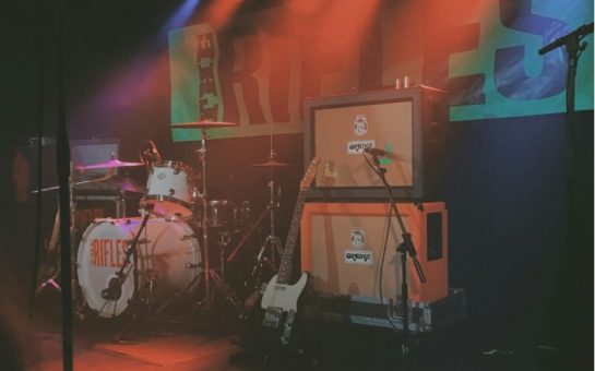 Instrument set up on a stage with bright florescent lights