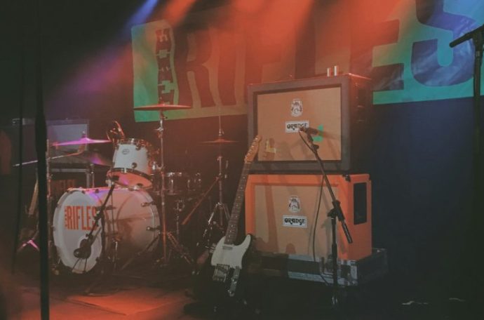 Instrument set up on a stage with bright florescent lights