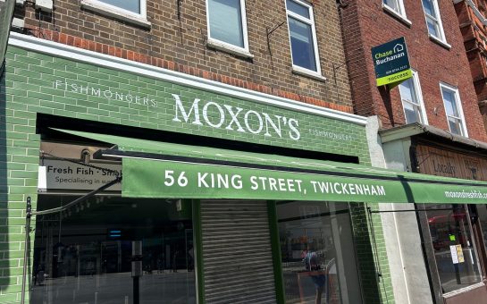 The green shopfront of Moxon's fishmongers in Twickenham.