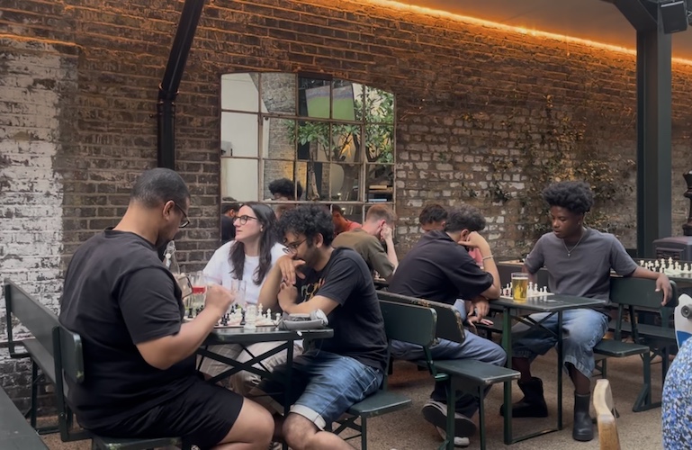 Attendees play Chess at The Hawk's Nest pub in Shepherd's Bush.