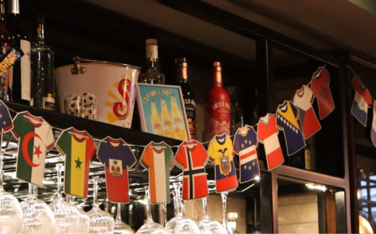 phot of countries flags on t-shorts in pubs