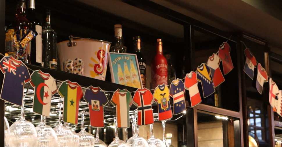 phot of countries flags on t-shorts in pubs