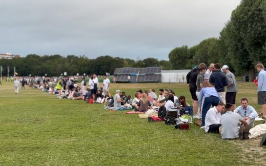 people sitting in line for the wimbledon queue
