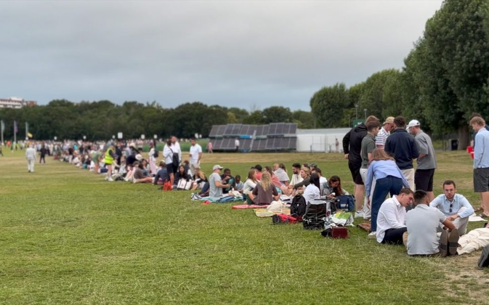 people sitting in line for the wimbledon queue