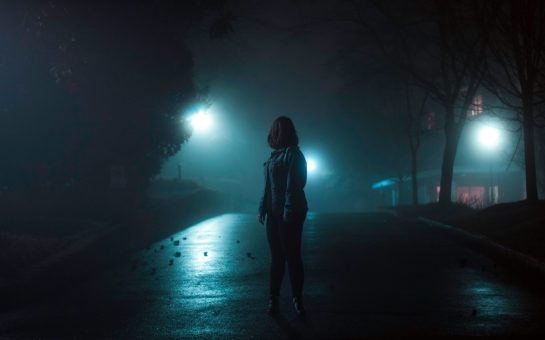 Woman walking alone at night