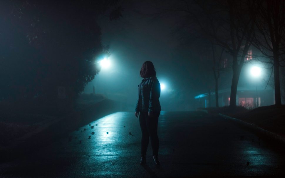 Woman walking alone at night
