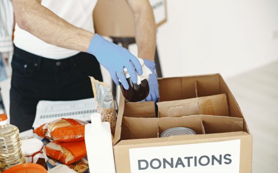Someone with donations box