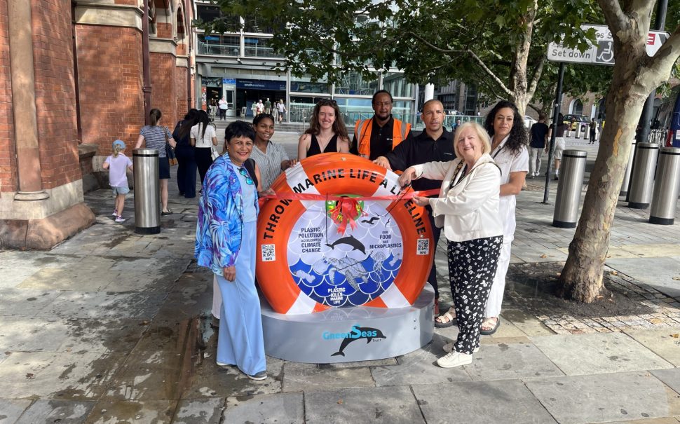 The recycling bin, in the shape of a lifebuoy, being unveiled outside St Pancras.