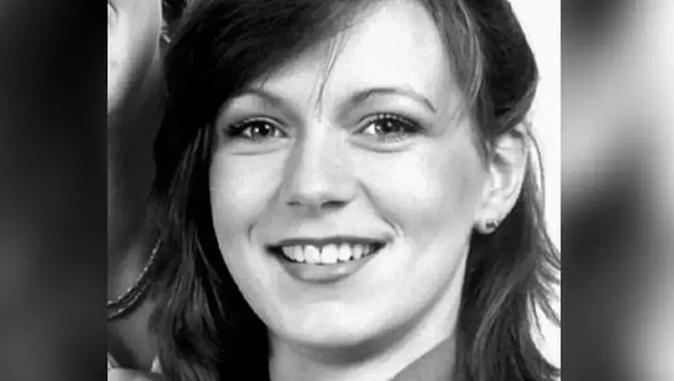 A black and white photo of a smiling Suzy Lamplugh.
