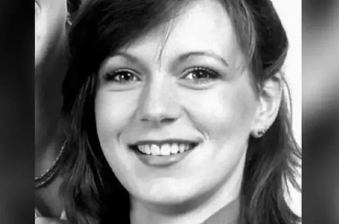 A black and white photo of a smiling Suzy Lamplugh.
