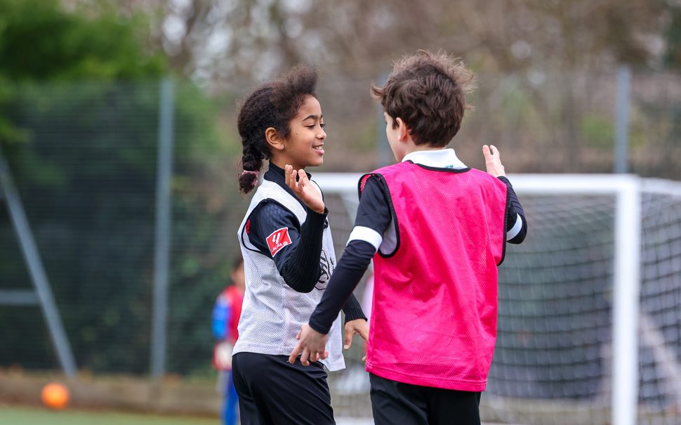 Kids playing football.