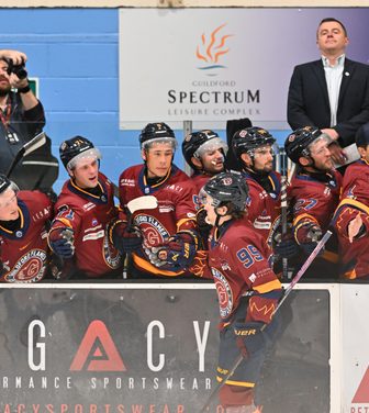 Guildford Flames bench celebrating a goal with the goal scorer, Cole Sanford
