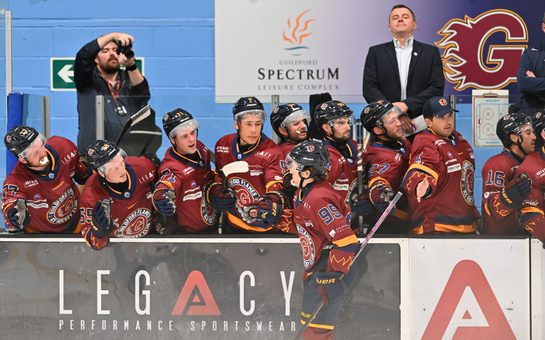 Guildford Flames bench celebrating a goal with the goal scorer, Cole Sanford