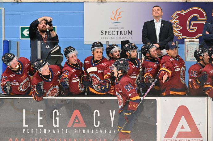 Guildford Flames bench celebrating a goal with the goal scorer, Cole Sanford