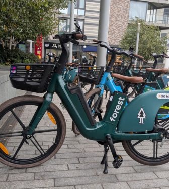 Forest bikes parked near London train station.