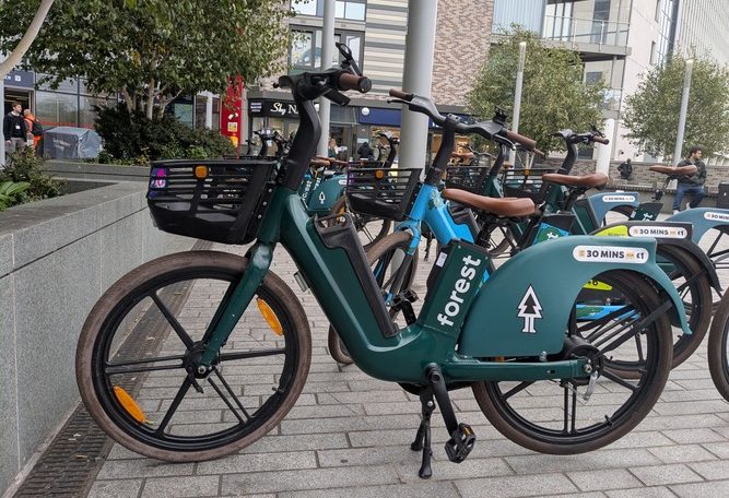 Forest bikes parked near London train station.