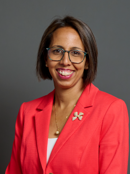 Munira Wilson, Liberal Democrat MP for Twickenham, dressed in a light red suit