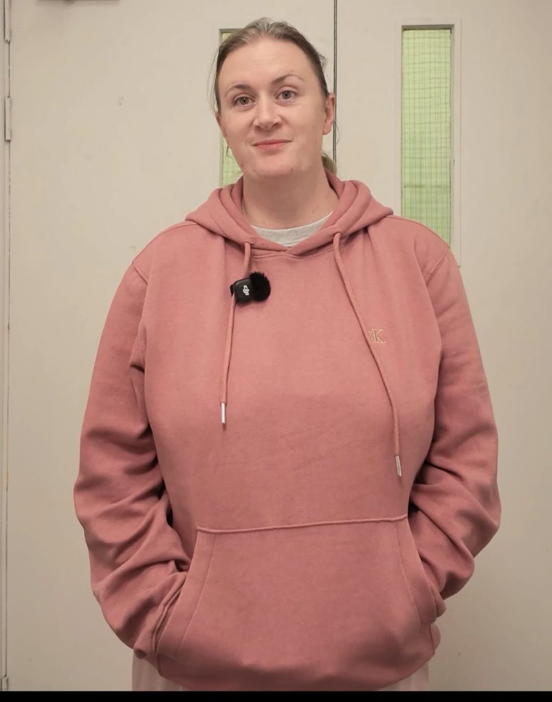 Sakinah Rumjaun in a pink hoodie