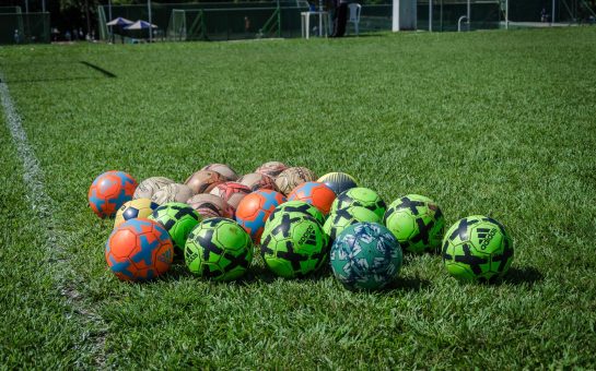 Footballs on a pitch