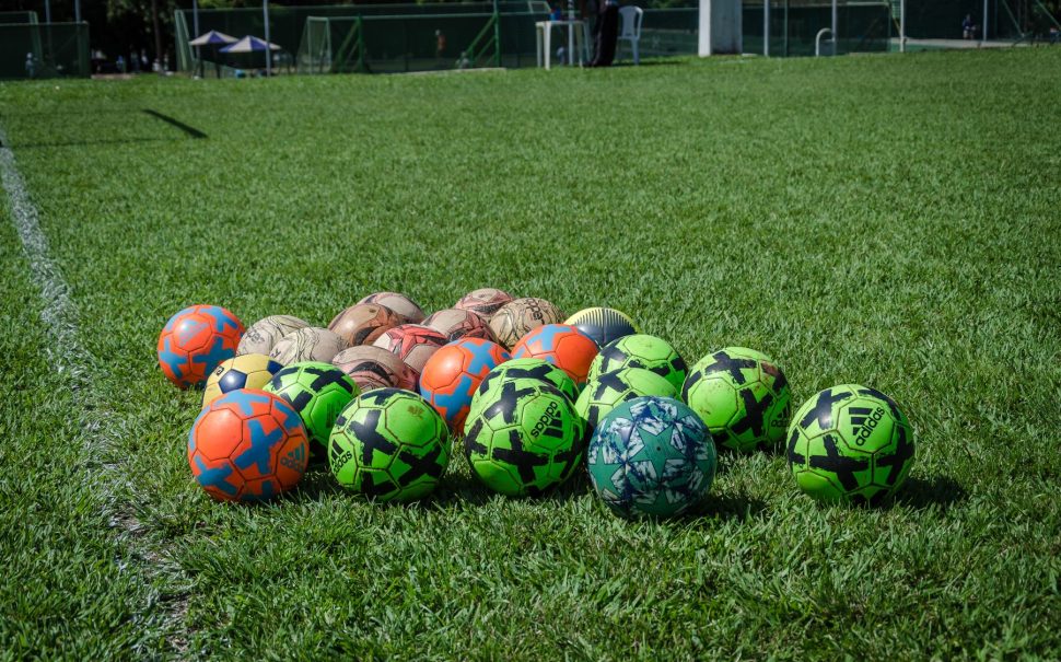 Footballs on a pitch