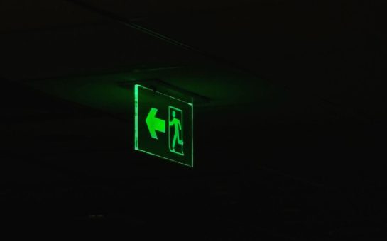 Photoluminescent fire exit sign in the dark (Picture: Free to use from Pexels)